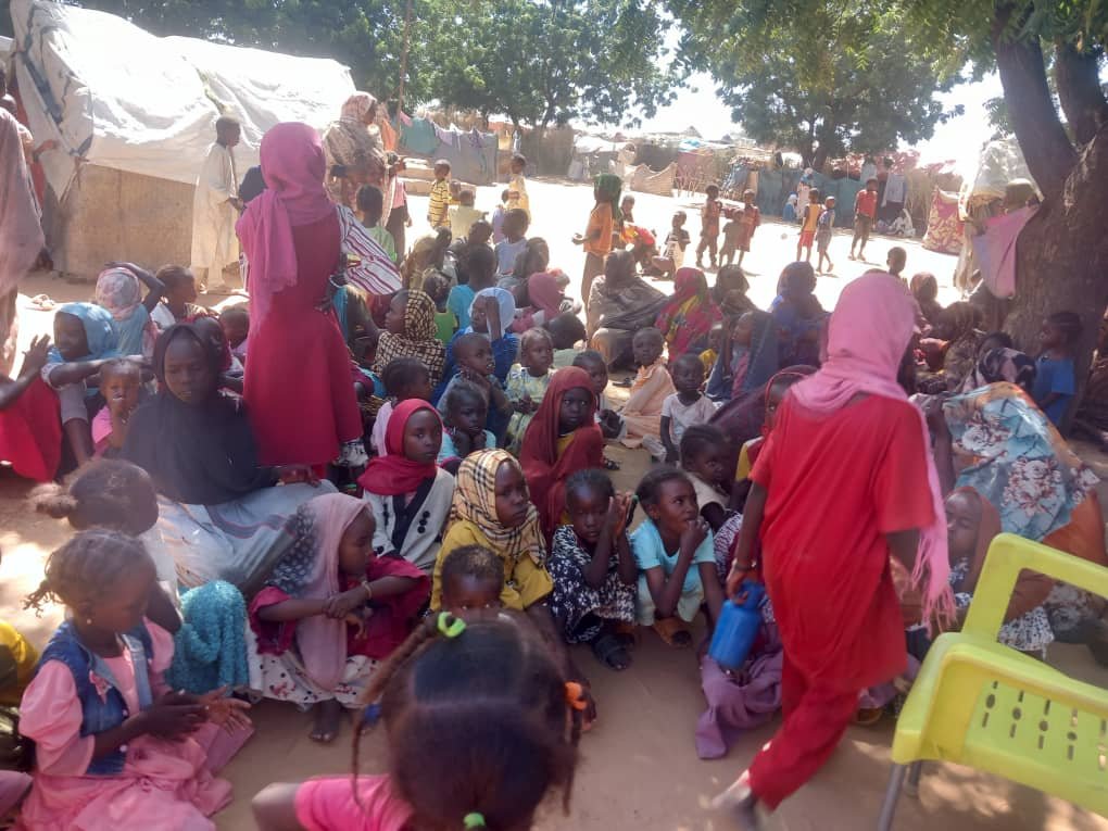 A community event providing both food basket distribution and psychological support services to displaced families.